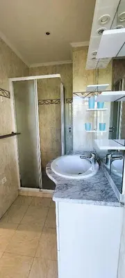 a bathroom with a large sink and a shower at Le Panoramique - Cannes - City Centre - Sea View - Swimming pool - Free Parking in Cannes