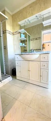 a bathroom with a sink and a mirror at Le Panoramique - Cannes - City Centre - Sea View - Swimming pool - Free Parking in Cannes