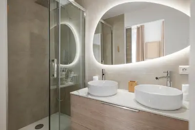 a bathroom with a sink and a mirror at Cannes heart, 3 BR, 3 Bath, 100m Palais & beach in Cannes