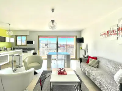 a living room with a couch and a table at Petit Juas by Welcome to Cannes in Cannes