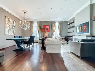 a living room with a table and a dining room at Beautiful 2 bedroom bourgeois style Antibes 333 in Cannes