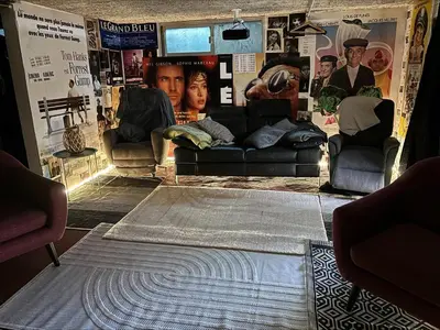 a living room with couches and a rug at L'Écrin d'Azur – Villa, Cinéma & Plage à 50m in Cannes
