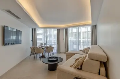 a living room with a couch and a table at Moderne et Chic T3, à deux pas de la Croisette in Cannes