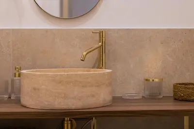 a bathroom with a concrete sink and a mirror at Exceptionnel face Palais Cannes in Cannes