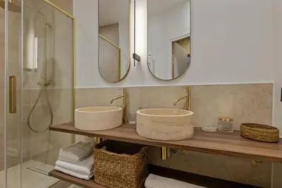 a bathroom with two sinks and a shower at Exceptionnel face Palais Cannes in Cannes