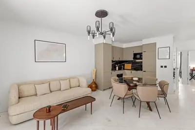 a living room with a couch and a table at Extraordinaire avec terrasse in Cannes