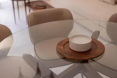 a glass table with a bowl on top of a chair at Extraordinaire avec terrasse in Cannes
