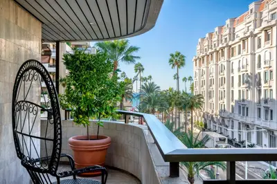 a balcony with a bench and a slide at REF 1924 - Cannes Croisette - Sea view apartment for rent in Cannes
