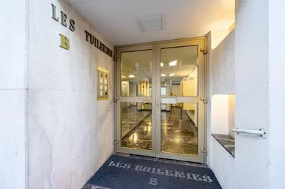 an entrance to a building with a sliding glass door at Ciel d Azur avec terrasse en plein centre près de la Croisette in Cannes