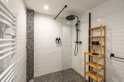 a bathroom with a shower and a glass shower stall at 5 CARNOT - Beautiful apartment, 4 people, 150m from Palais des Festivals in Cannes