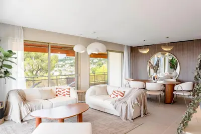a living room with white furniture and a table at REF 1965 - Le Cannet - Sea view apartment for rent in Le Cannet