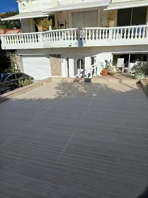 a large parking lot in front of a house at La matoune in Cannes
