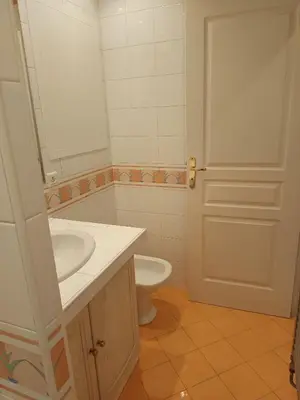 a bathroom with a white sink and a toilet at La matoune in Cannes