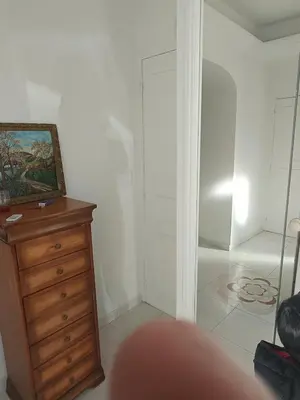 a room with a dresser and a closet at La matoune in Cannes