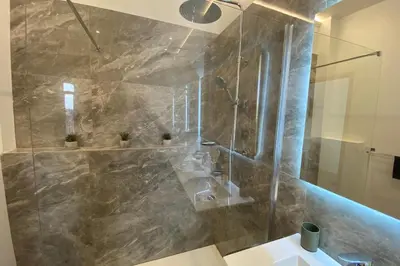 a bathroom with a shower and a sink at 06CJ Beautiful apartment in the heart of Cannes in Cannes