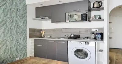 a kitchen with a sink and a washing machine at L'Hippocampe - Studio - Croisette - Proche Palais in Cannes