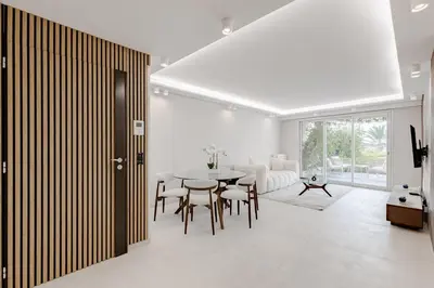 a dining room with a table and chairs at Cannes apartment sea view - 18H in Cannes