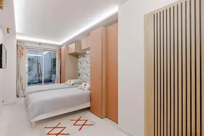 a bedroom with a bed and a window at Cannes apartment sea view - 18H in Cannes