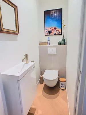 a bathroom with a white toilet and a sink at Une véritable perle 342L HUI in Cannes