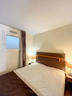 a bedroom with a large bed and a window at A deux pas des plages du Midi 308L Mour in Cannes
