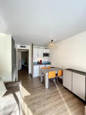 a kitchen and dining room with a table and chairs at A deux pas des plages du Midi 308L Mour in Cannes