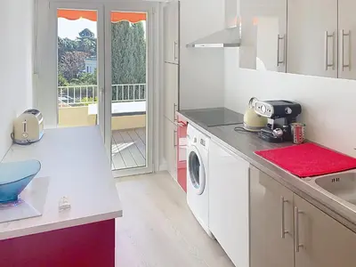 a kitchen with a sink and a washing machine at Superbe 2 pièces 344L Jol in Cannes