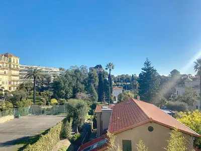 arial view of a house with a street and trees at Superbe 2 pièces 344L Jol in Cannes