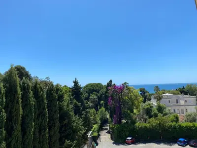 an aerial view of a park with trees and a building at Superbe 2 pièces 344L Jol in Cannes