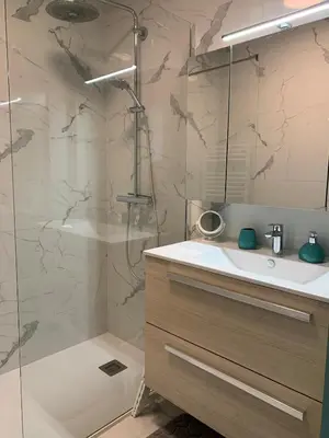 a bathroom with a shower and a sink and a tub at A 2 pas des plages du Midi, 261L DEPER in Cannes