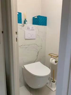 a bathroom with a white toilet in a room at A 2 pas des plages du Midi, 261L DEPER in Cannes
