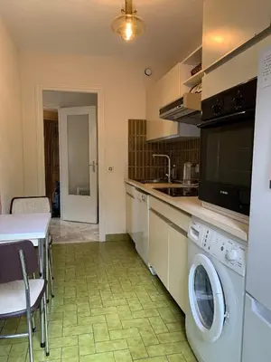 a kitchen with a washer and dryer in a room at A 2 pas des plages du Midi, 261L DEPER in Cannes