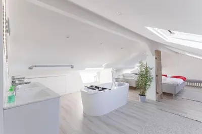 a white bathroom with a sink and a bed at Syssi - 3 Chambres avec salles de bains, spacieux, calme, moderne, idéal congrès in Cannes