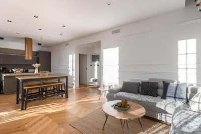 a living room with a couch and a table at Syssi - 3 Chambres avec salles de bains, spacieux, calme, moderne, idéal congrès in Cannes