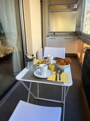 a table with a breakfast of coffee and pastries on it at Studio premium St Louis - emplacement idéal in Cannes