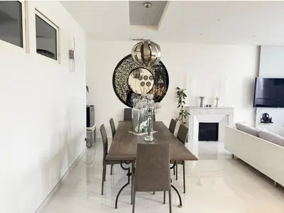 a dining room with a table and a couch at Appartement Haut Standing 5 pièces Cannes centre in Cannes