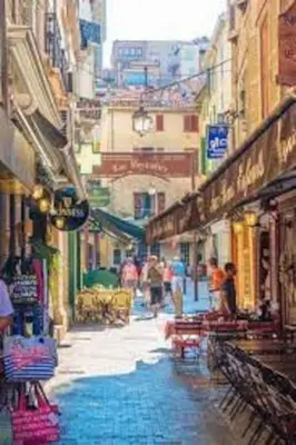 a city street with people walking down the street at Emplacement idéal 450 métres du Palais croisette plage in Cannes
