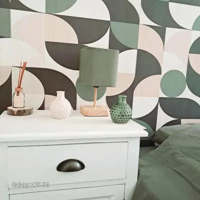 a nightstand with vases and a lamp on it at Emplacement idéal 450 métres du Palais croisette plage in Cannes