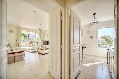 a hallway with a door leading to a living room at Spacieux 2 chambres TERRASSE, PARKING proche CENTRE VILLE A2B237 in Cannes