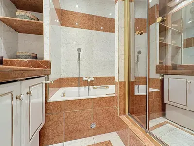 a bathroom with a shower and a tub at Intuition - 2 personnes - Le Fragonard in Cannes