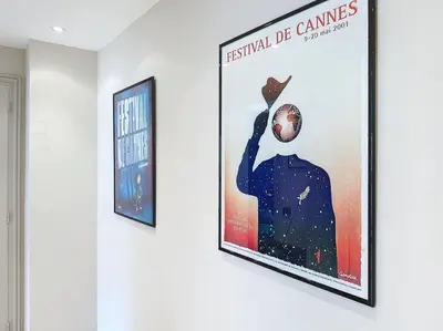 a poster of a man holding a ball on a wall at Intuition - 2 personnes - Le Fragonard in Cannes