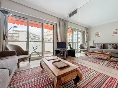 a living room with a couch and a table at Intuition - 2 personnes - Le Fragonard in Cannes