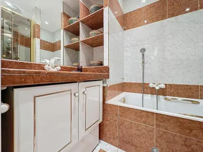 a bathroom with a tub and a shower and a sink at Intuition - 2 personnes - Le Fragonard in Cannes