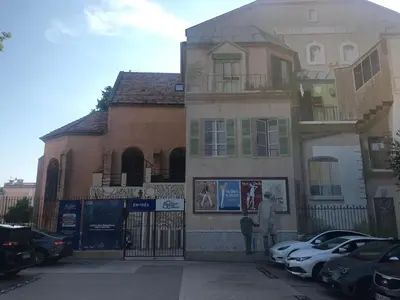 a building with cars parked in front of it at T2 Vallombrosa Terrasse Parking in Cannes