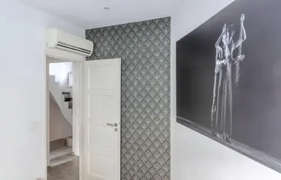 a hallway with a wall with a stenciled wall at Maison 4 chambres - Cannes centre -Clim WIFI 7 personnes in Cannes