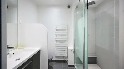 a bathroom with a shower and a toilet and a sink at Commandant André in Cannes