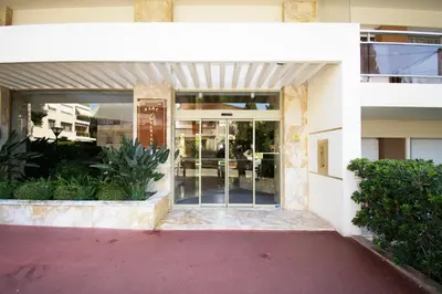 an entrance to a building with a glass door at Le Studio Cannois Standing Presta in Cannes
