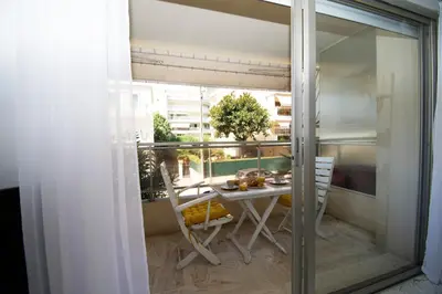 a view of a balcony with a table and chairs at Le Studio Cannois Standing Presta in Cannes