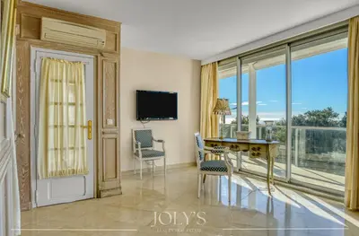 a living room with a desk and a large window at Villa d'architecte Super Cannes - Vue panoramique in Cannes