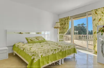 a bedroom with a bed and a large window at Villa d'architecte Super Cannes - Vue panoramique in Cannes