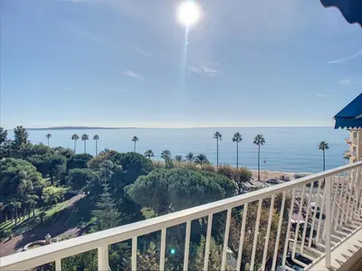 a view of the ocean from the balcony of a resort at Belle terrasse vue mer , proche plages 223L FOV in Cannes
